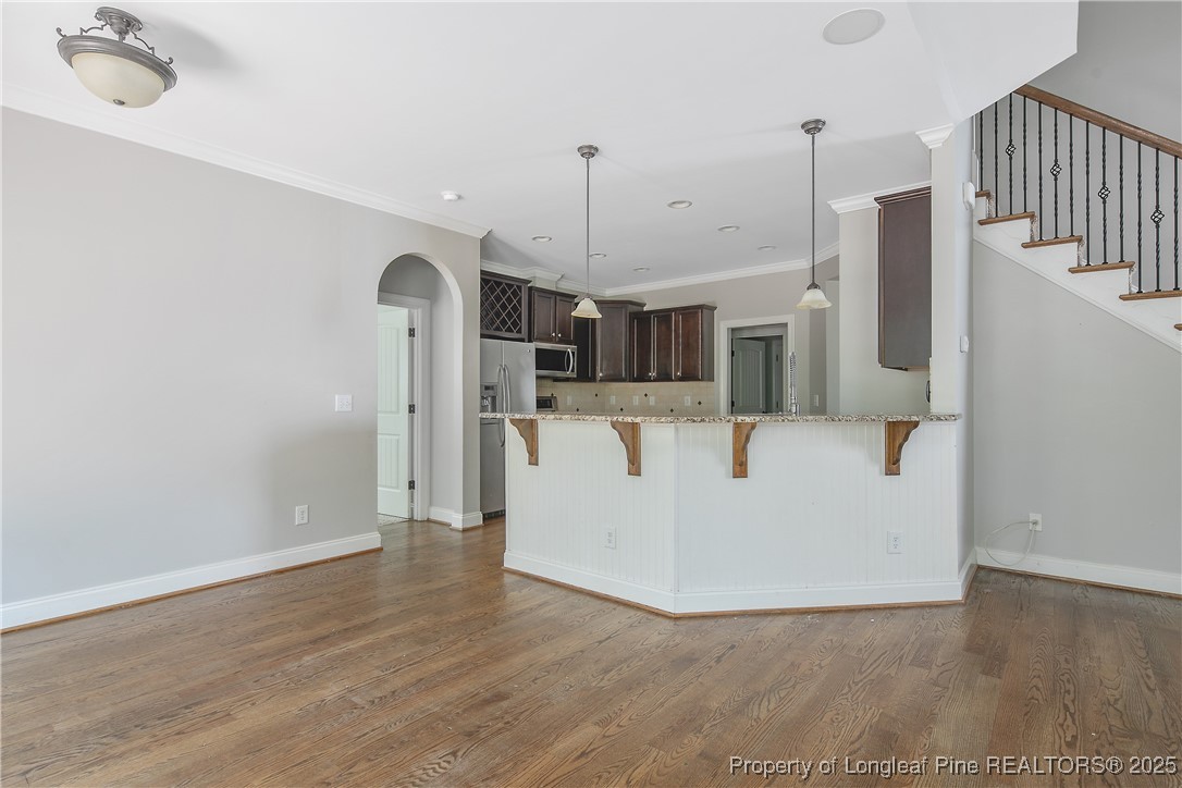 716 Micahs Way North Spring Lake, NC 28390 - Photo 16 of 50 a view of a kitchen with wooden floor and a sink