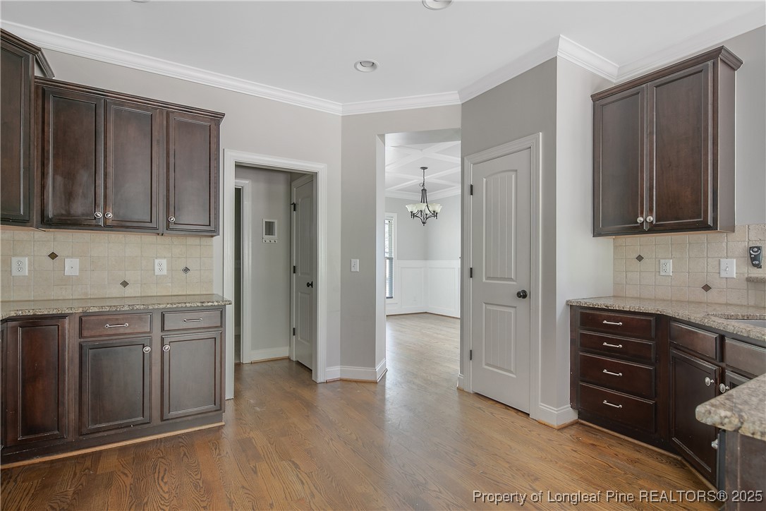 716 Micahs Way North Spring Lake, NC 28390 - Photo 19 of 50 a spacious bathroom with a granite countertop sink a mirror and a bathtub