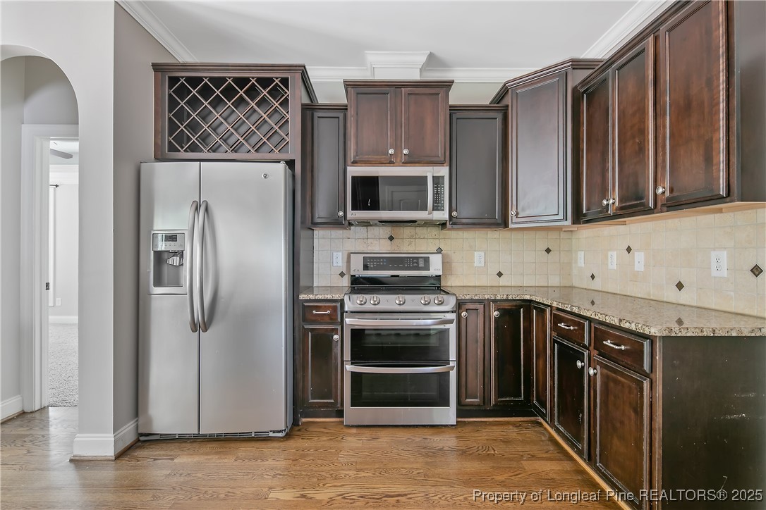 716 Micahs Way North Spring Lake, NC 28390 - Photo 20 of 50 a kitchen with a refrigerator sink and cabinets