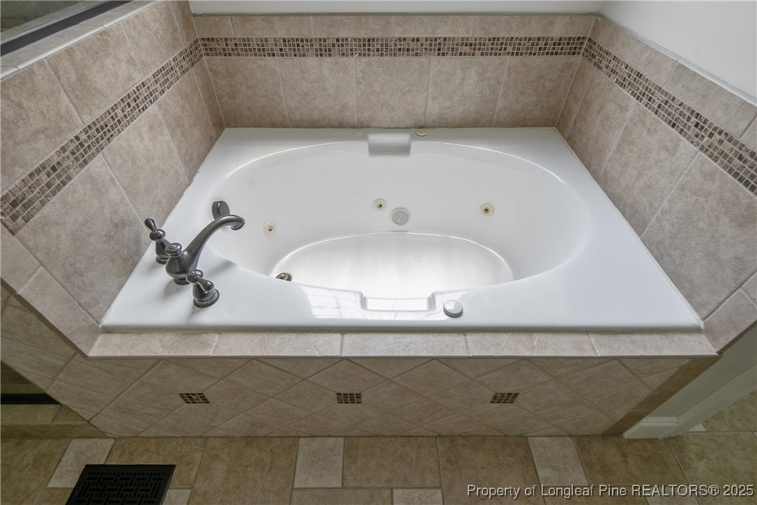 716 Micahs Way North Spring Lake, NC 28390 - Photo 33 of 50 a bathroom with a bathtub and shower