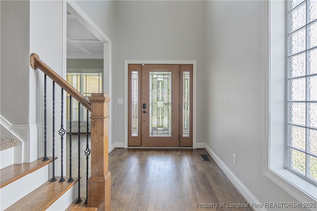 716 Micahs Way North Spring Lake, NC 28390 - Photo 6 of 50 wooden floor in an empty room with a window