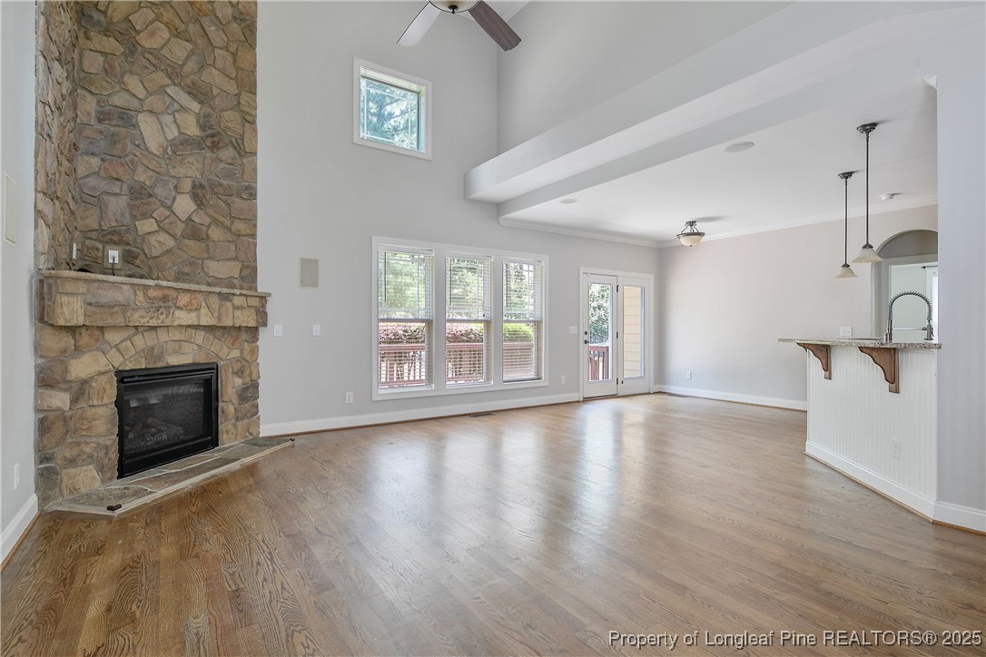 716 Micahs Way North Spring Lake, NC 28390 - Photo 10 of 50 a view of an empty room with a fireplace and a window