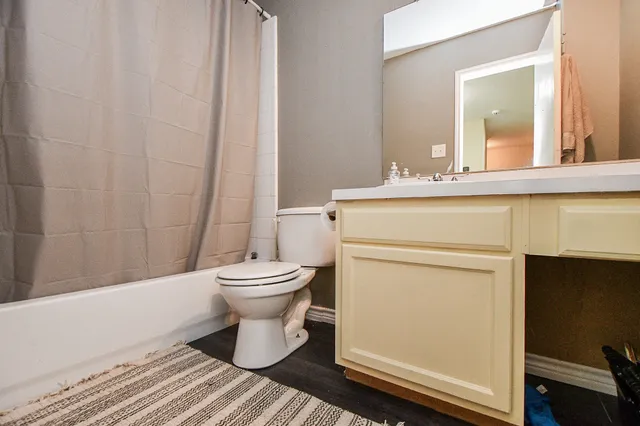 a bathroom with a toilet and a sink