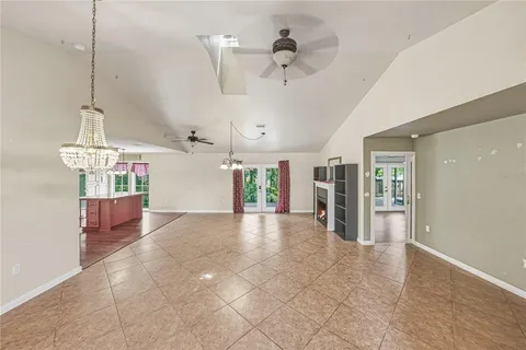 a kitchen with kitchen island granite countertop a stove and wooden floor