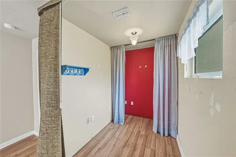 a view of an empty room with a large window
