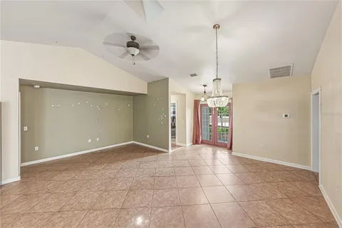 a view of a livingroom with a fireplace and a ceiling fan