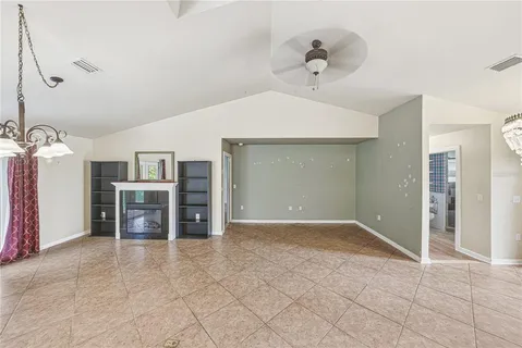 a kitchen with stainless steel appliances granite countertop a refrigerator a sink and wooden floors
