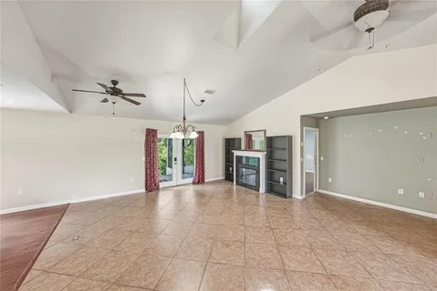 a kitchen with kitchen island granite countertop a sink a counter space appliances and cabinets