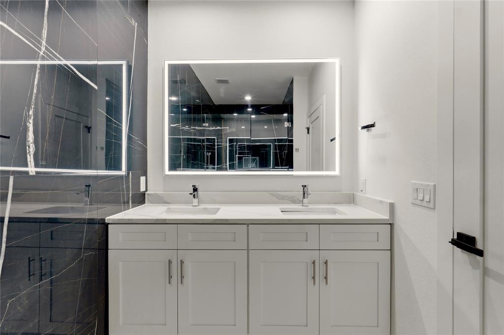 7207 Mohawk Drive, Unit B 3 Dallas, TX 75235 - Photo 13 of 19 a bathroom with a sink and a mirror