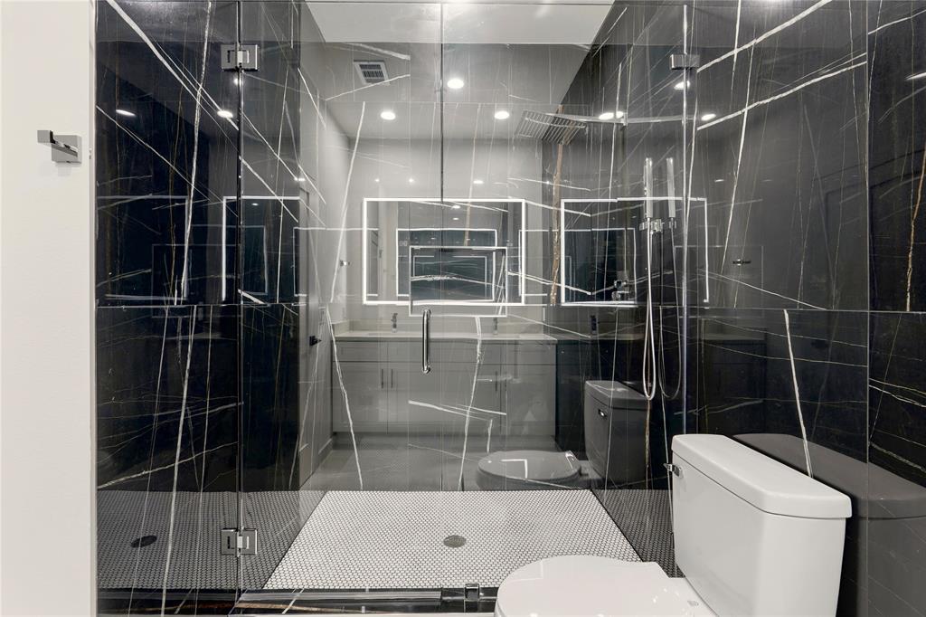 7207 Mohawk Drive, Unit B 3 Dallas, TX 75235 - Photo 14 of 19 a bathroom with a toilet sink and shower