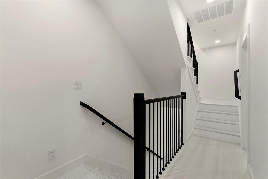7207 Mohawk Drive, Unit B 3 Dallas, TX 75235 - Photo 15 of 19 a view of a hallway with staircase