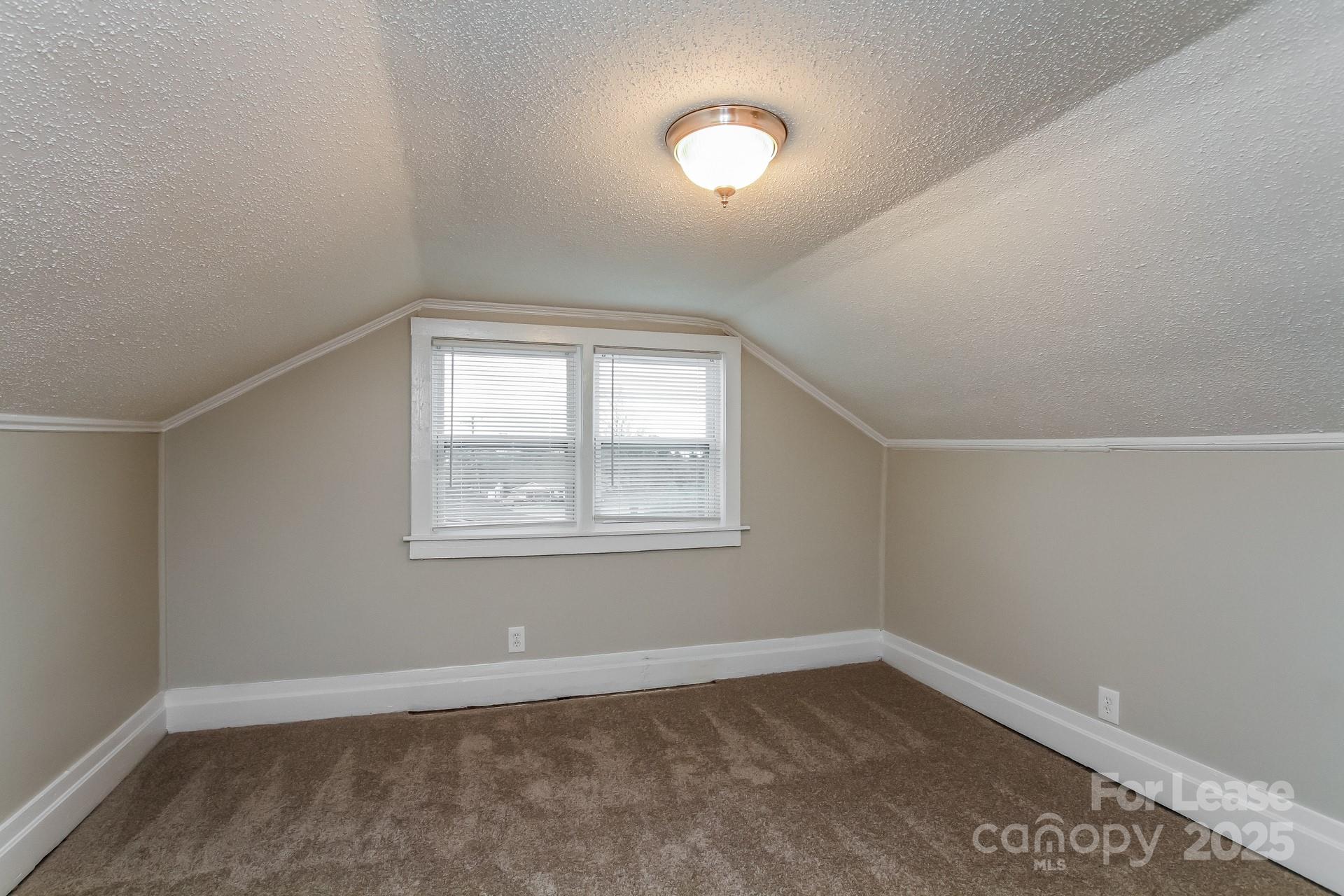 154 Ruffin Loop Troutman, NC 28166 - Photo 11 of 18 an empty room with a window