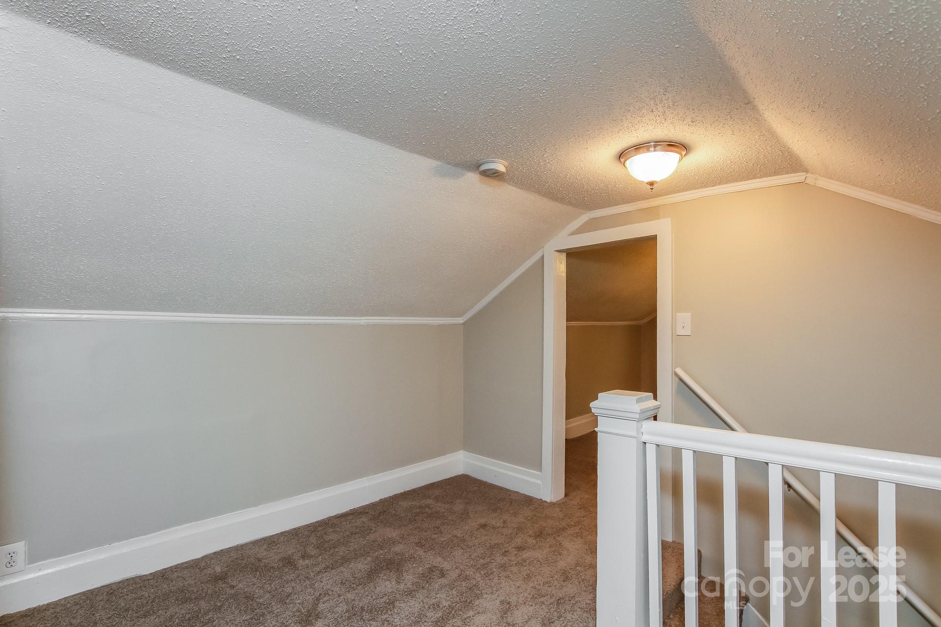 154 Ruffin Loop Troutman, NC 28166 - Photo 15 of 18 a view of entryway with stairs