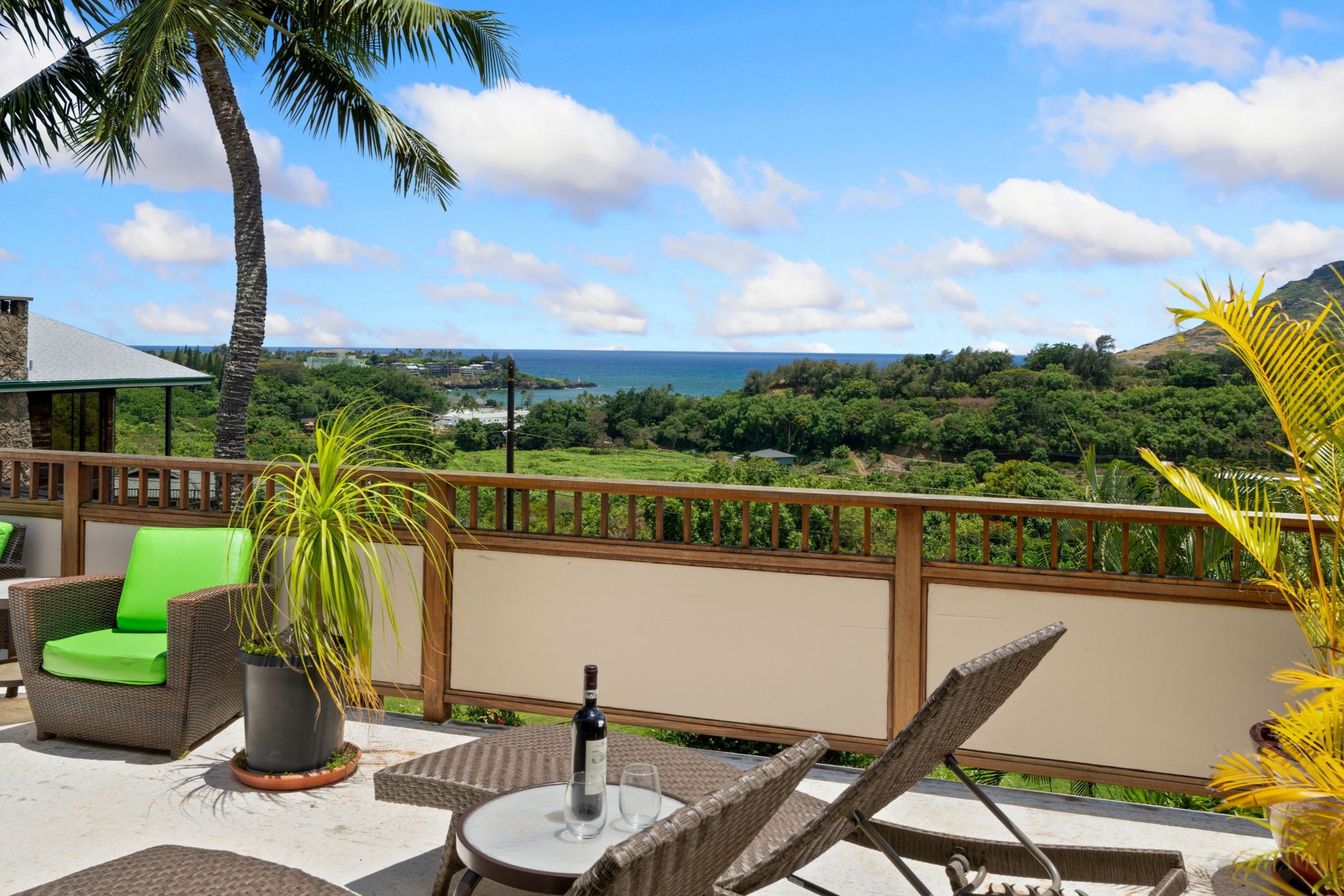 2938 Mokoi Street Lihue, HI 96766 - Photo 15 of 30 a view of a balcony with chairs and palm tree