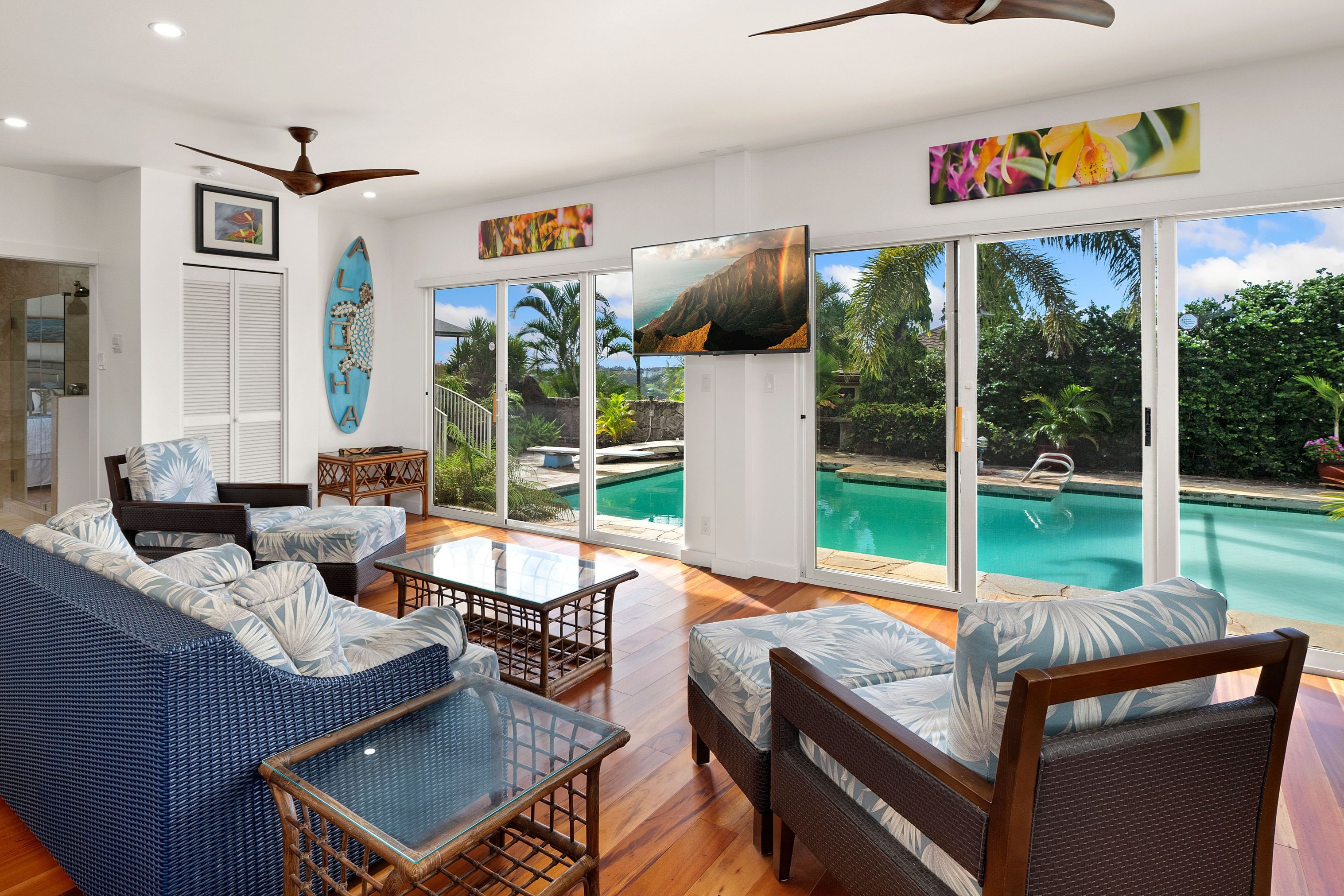 2938 Mokoi Street Lihue, HI 96766 - Photo 17 of 30 a living room with furniture and a floor to ceiling window