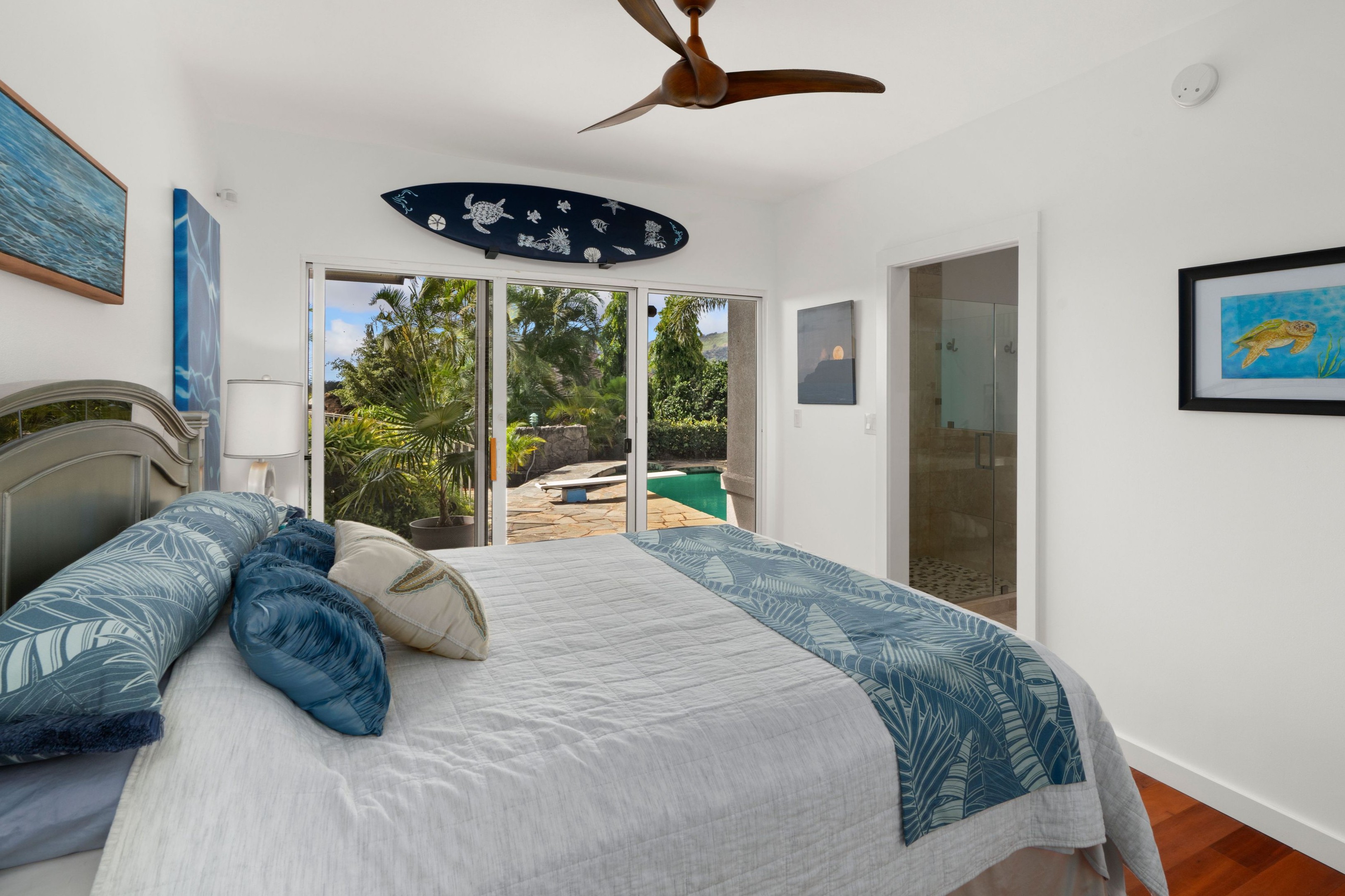 2938 Mokoi Street Lihue, HI 96766 - Photo 21 of 30 a bedroom with a bed a couch and large window