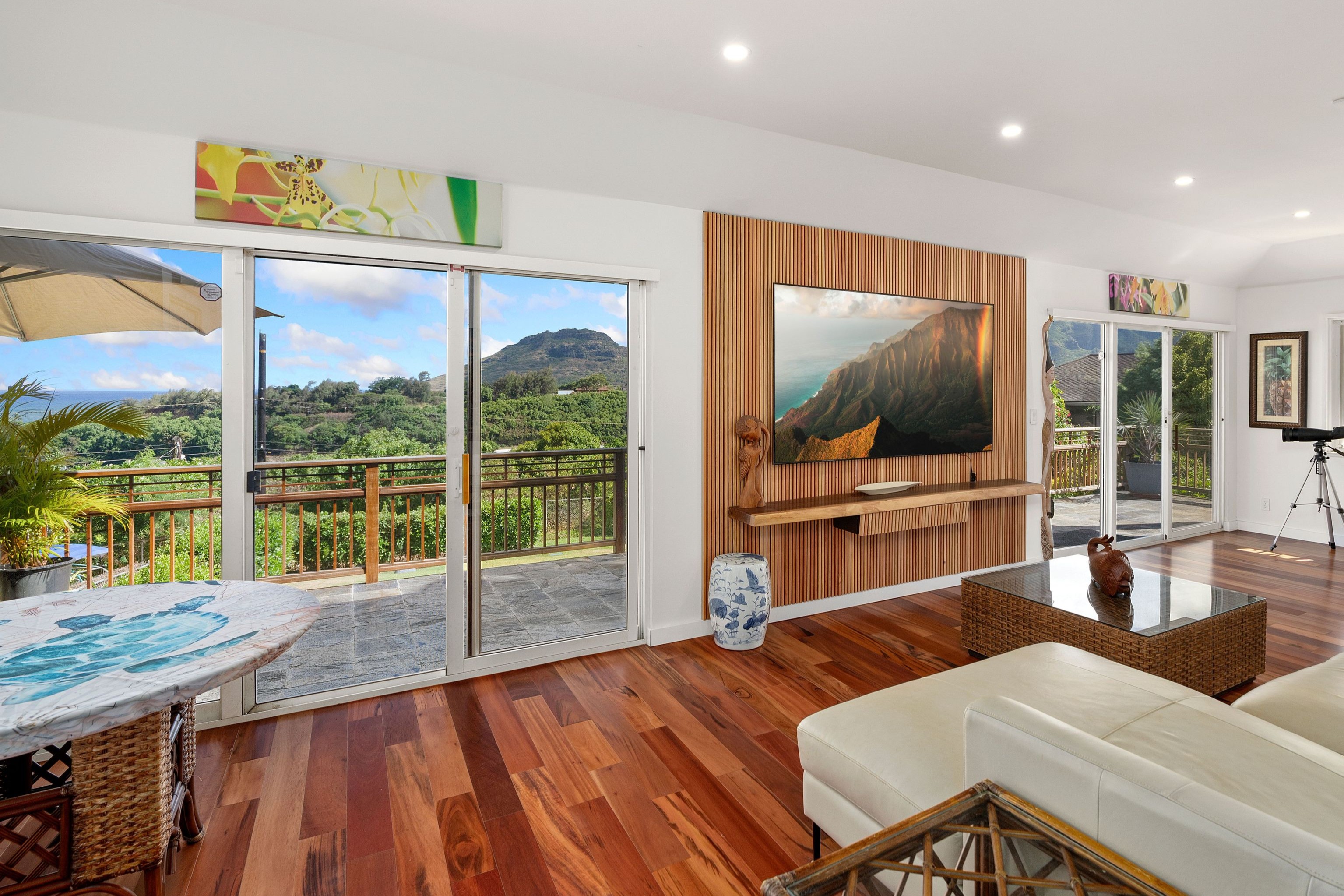 2938 Mokoi Street Lihue, HI 96766 - Photo 25 of 30 a living room with furniture tv and wooden floor