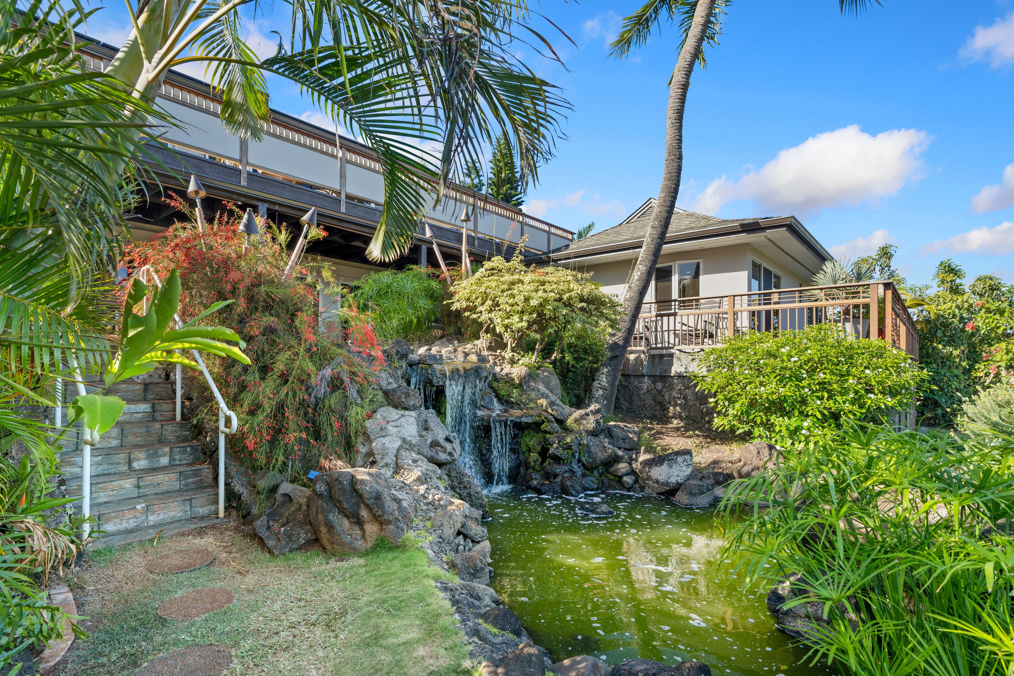 2938 Mokoi Street Lihue, HI 96766 - Photo 29 of 30 a view of a house with a yard and potted plants