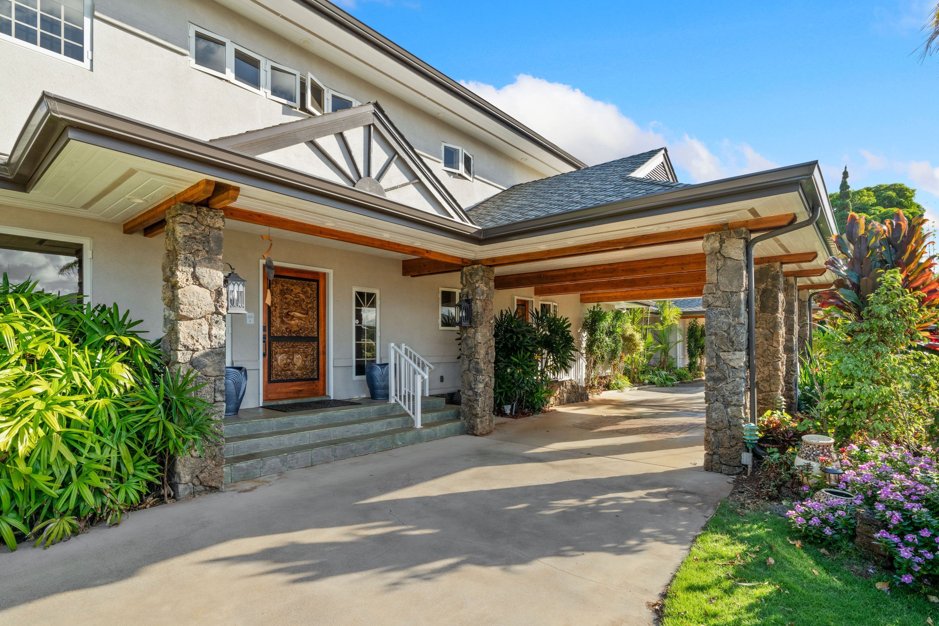 2938 Mokoi Street Lihue, HI 96766 - Photo 4 of 30 a front view of a house with garden