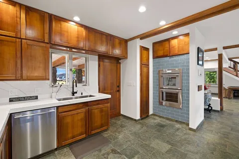 a kitchen with a sink and cabinets