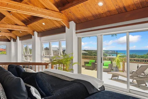 a living room with a couch and a large window