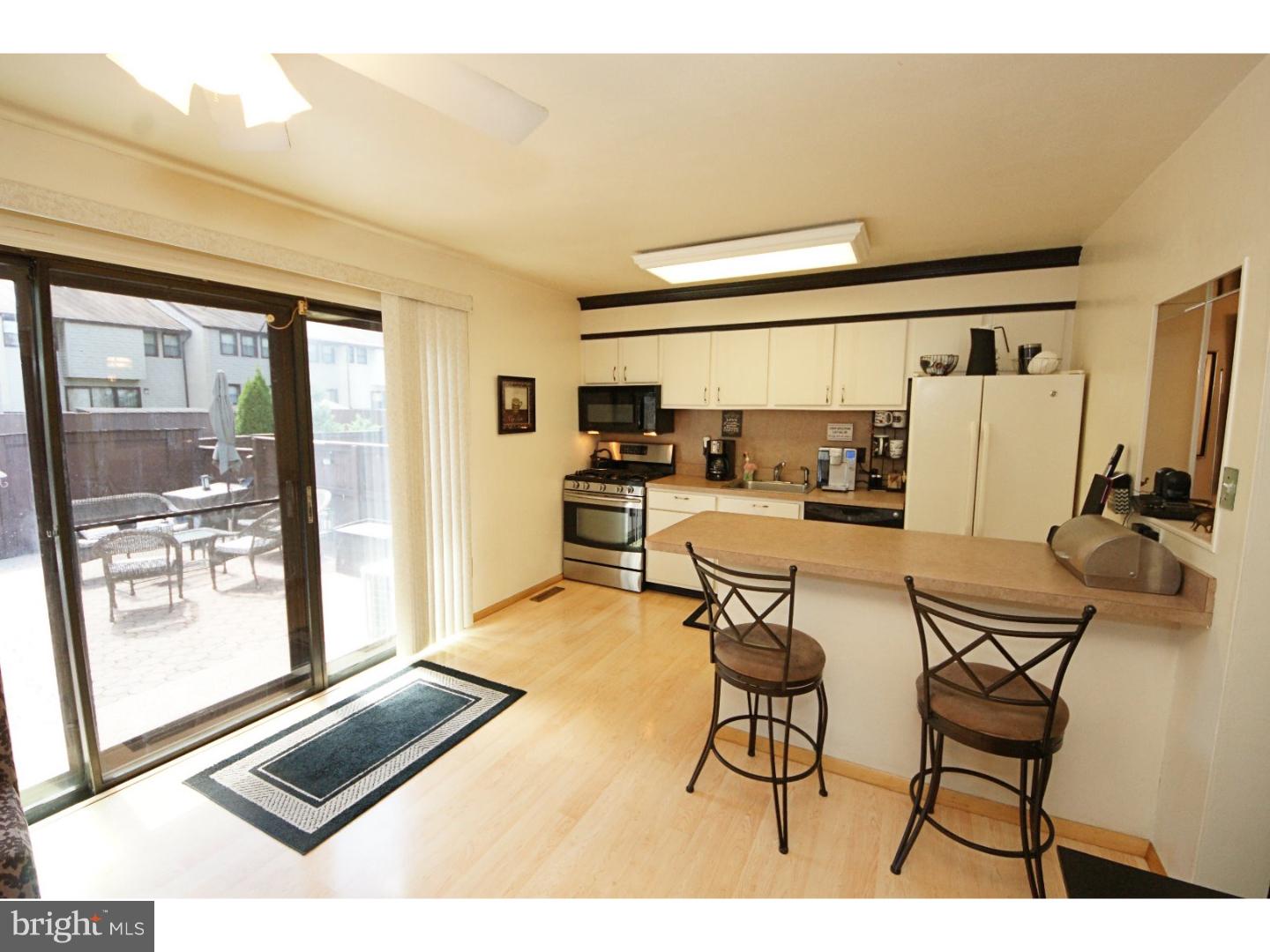 885 Jamestown Road East Windsor, NJ 08520 - Photo 12 of 25 a living room with furniture and a flat screen tv