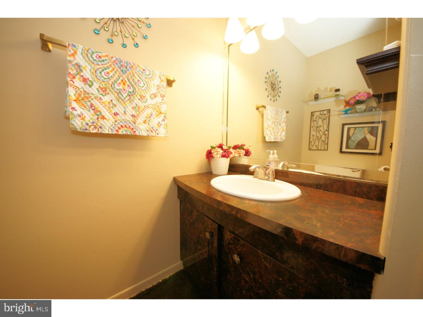 885 Jamestown Road East Windsor, NJ 08520 - Photo 13 of 25 a bathroom with a sink and a mirror
