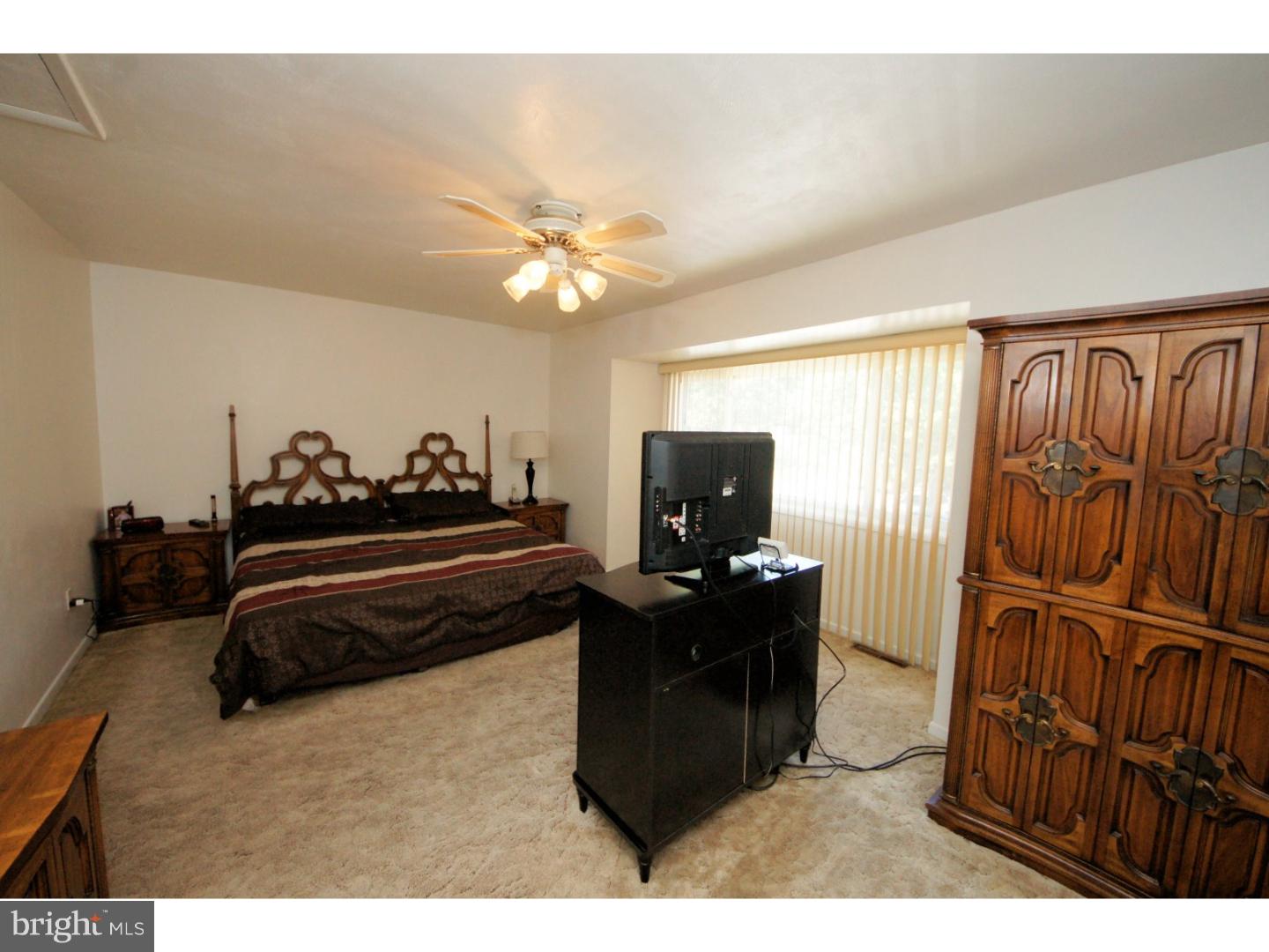 885 Jamestown Road East Windsor, NJ 08520 - Photo 14 of 25 a living room with furniture and a flat screen tv