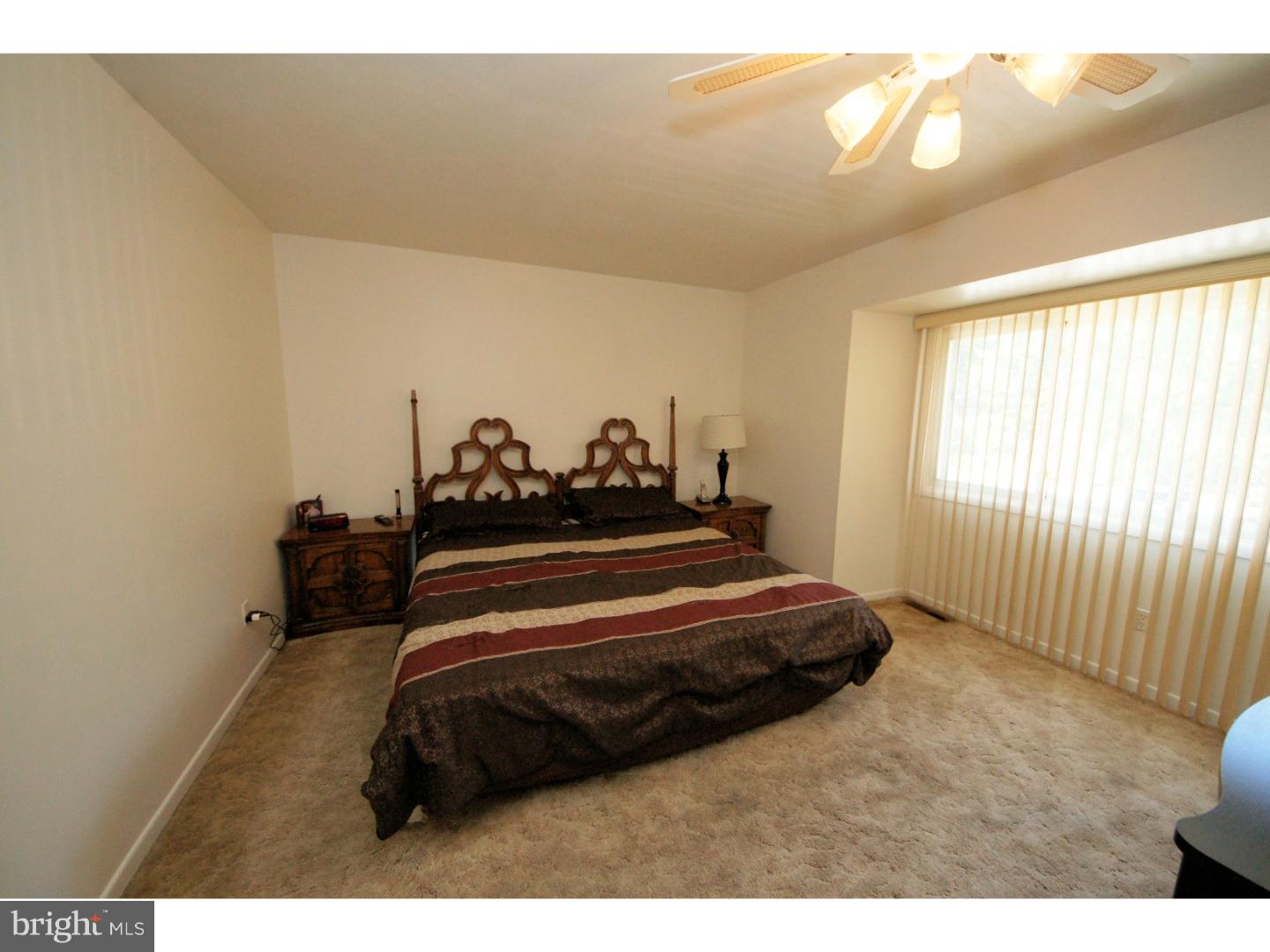 885 Jamestown Road East Windsor, NJ 08520 - Photo 15 of 25 a bedroom with a bed and window