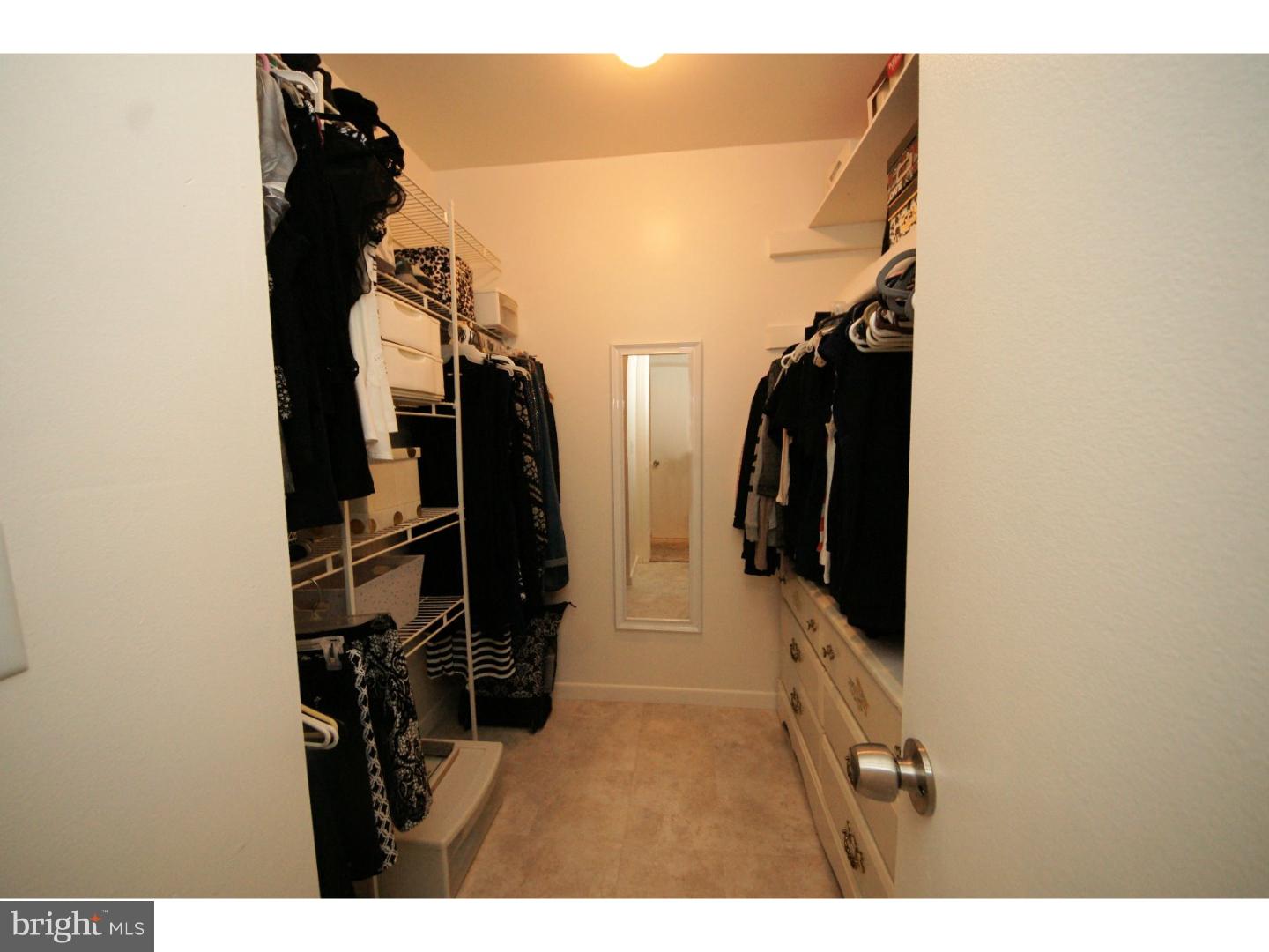 885 Jamestown Road East Windsor, NJ 08520 - Photo 17 of 25 a view of walk in closet with clothes and shoes