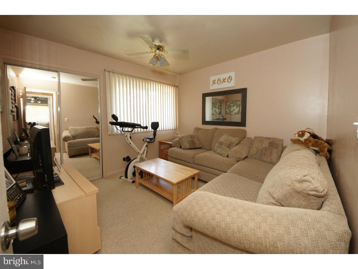 885 Jamestown Road East Windsor, NJ 08520 - Photo 18 of 25 a living room with furniture and wooden floor