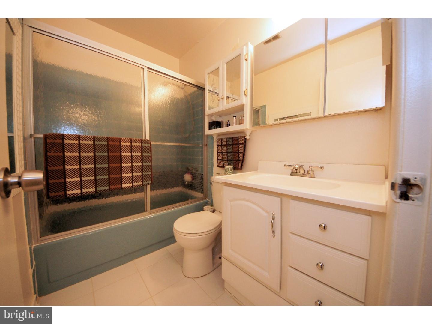 885 Jamestown Road East Windsor, NJ 08520 - Photo 20 of 25 a bathroom with a sink a toilet and shower