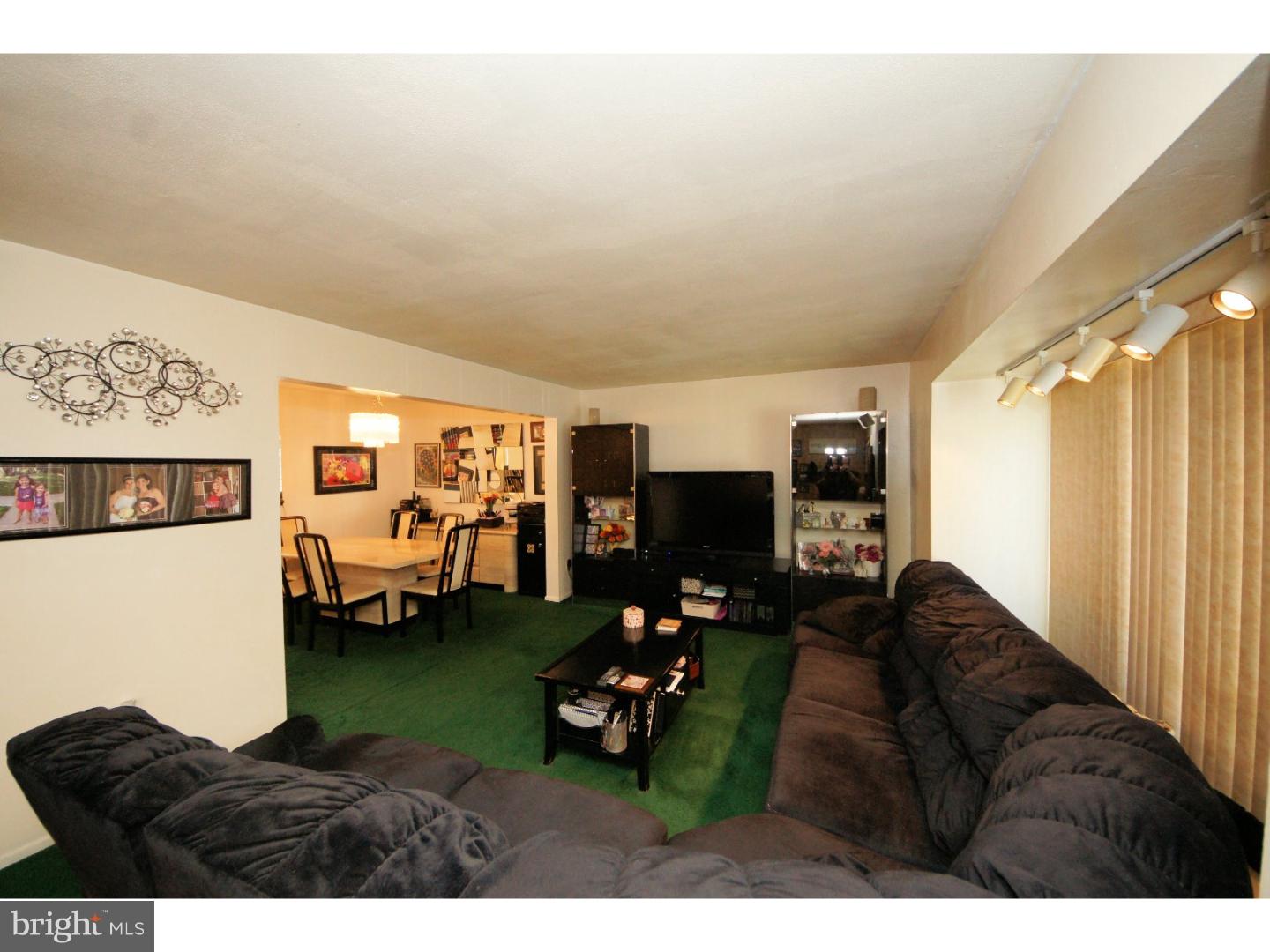 885 Jamestown Road East Windsor, NJ 08520 - Photo 3 of 25 a living room with furniture and a flat screen tv