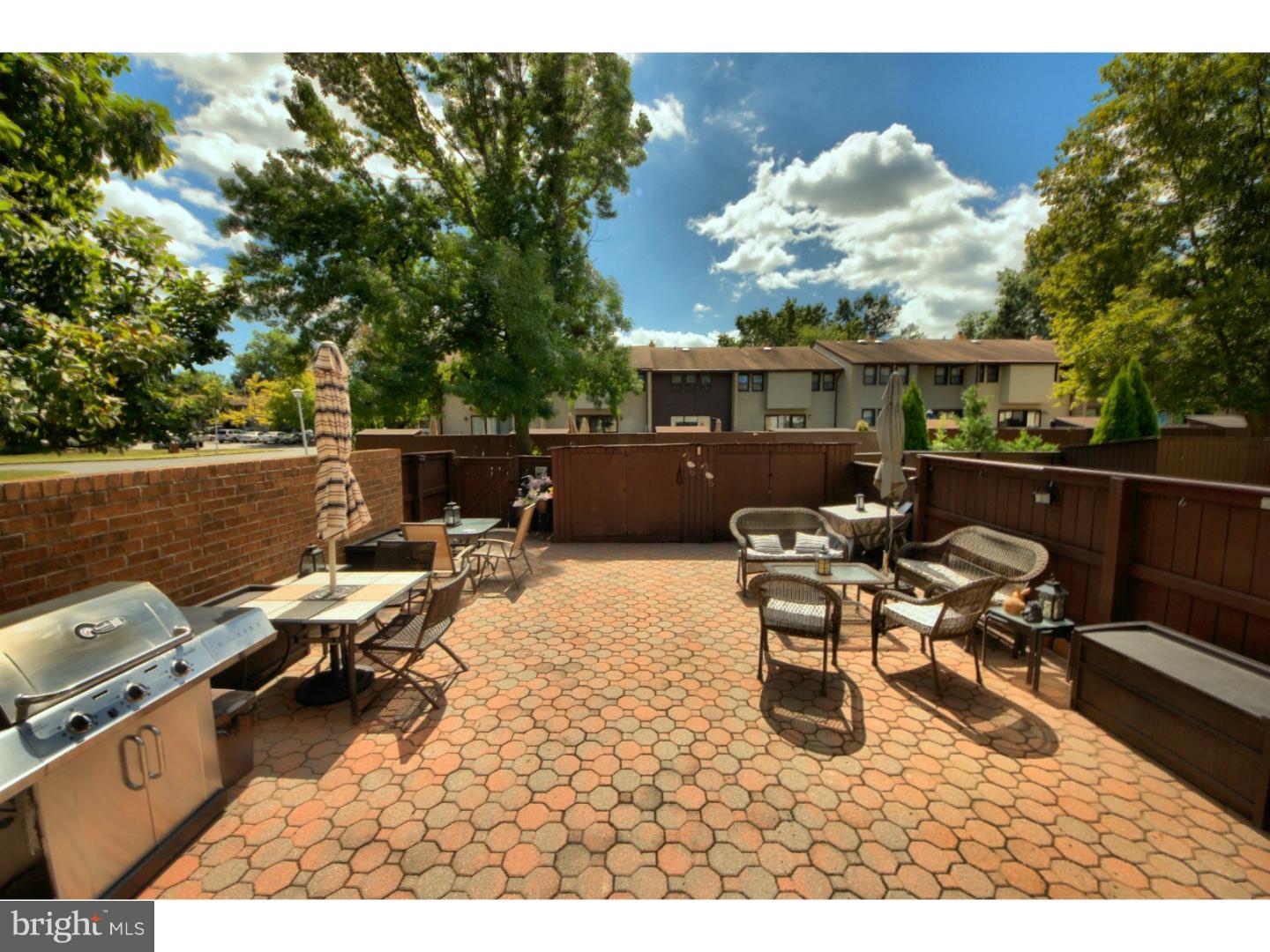 885 Jamestown Road East Windsor, NJ 08520 - Photo 24 of 25 a view of a patio with couches table and chairs and potted plants