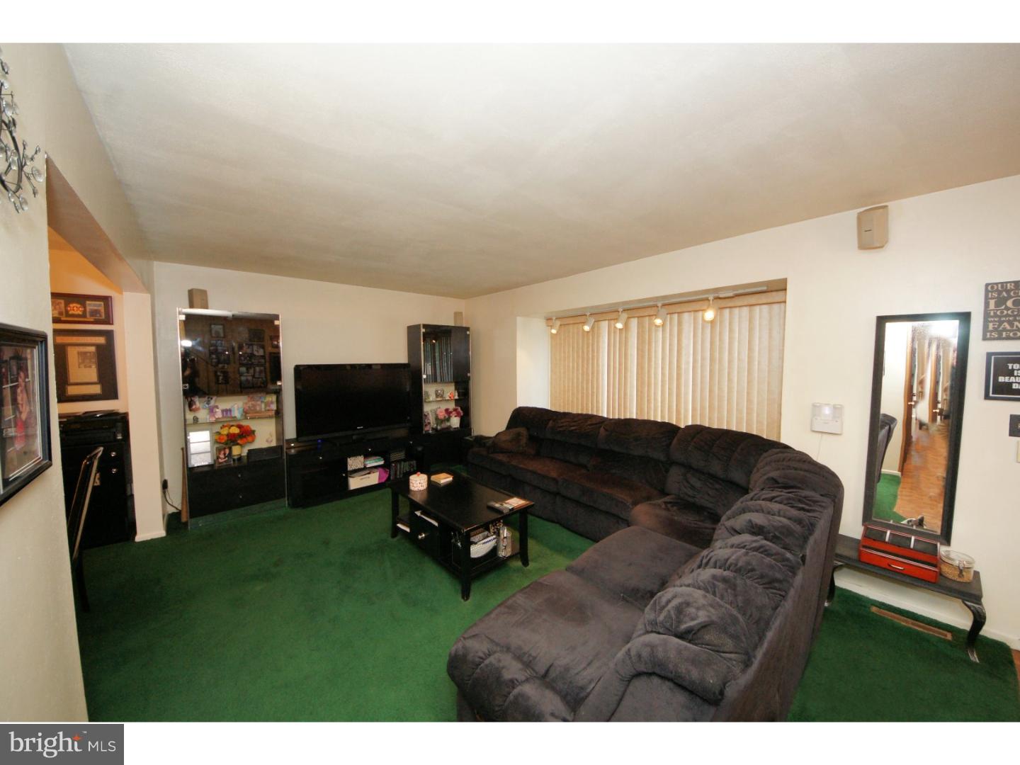 885 Jamestown Road East Windsor, NJ 08520 - Photo 4 of 25 a living room with furniture and a flat screen tv