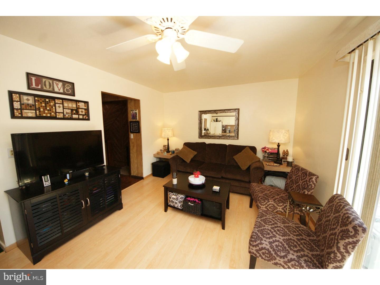 885 Jamestown Road East Windsor, NJ 08520 - Photo 10 of 25 a living room with furniture and a flat screen tv