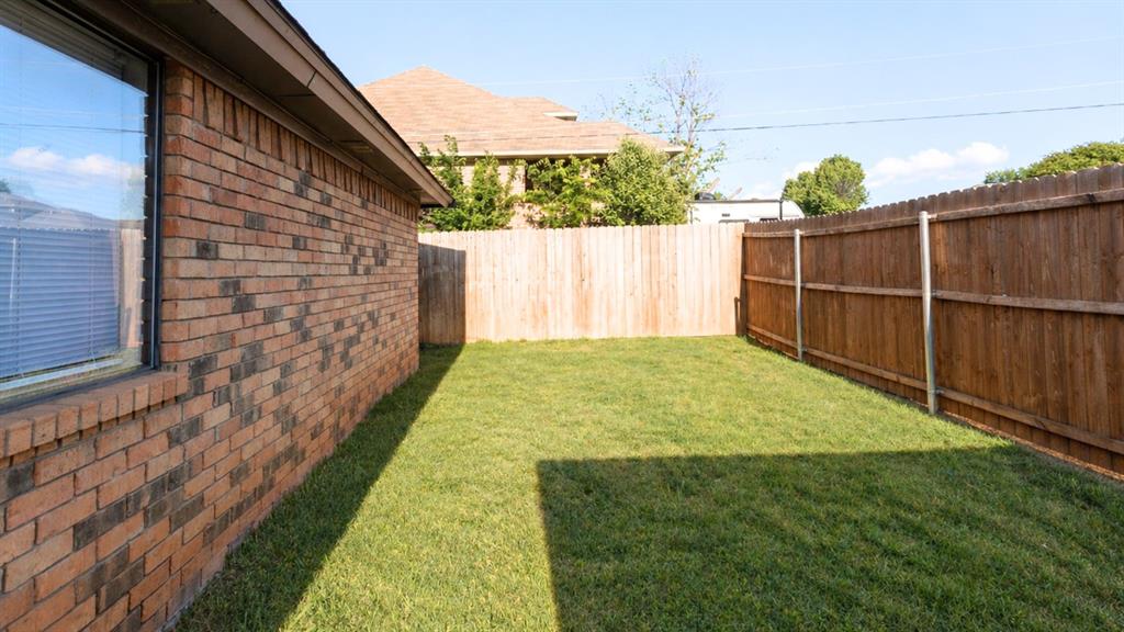 304 Moore Creek Road, Unit 300 Hurst, TX 76053 - Photo 17 of 17 Expansive lawn area enclosed by a full privacy fence