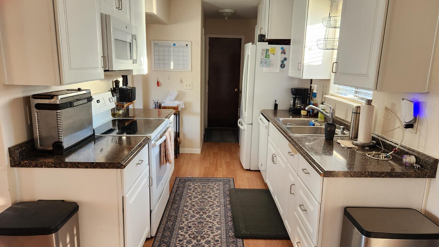 2786 Oak Street Anderson, CA 96007 - Photo 1 of 21 a kitchen with stainless steel appliances granite countertop a stove a sink and a refrigerator