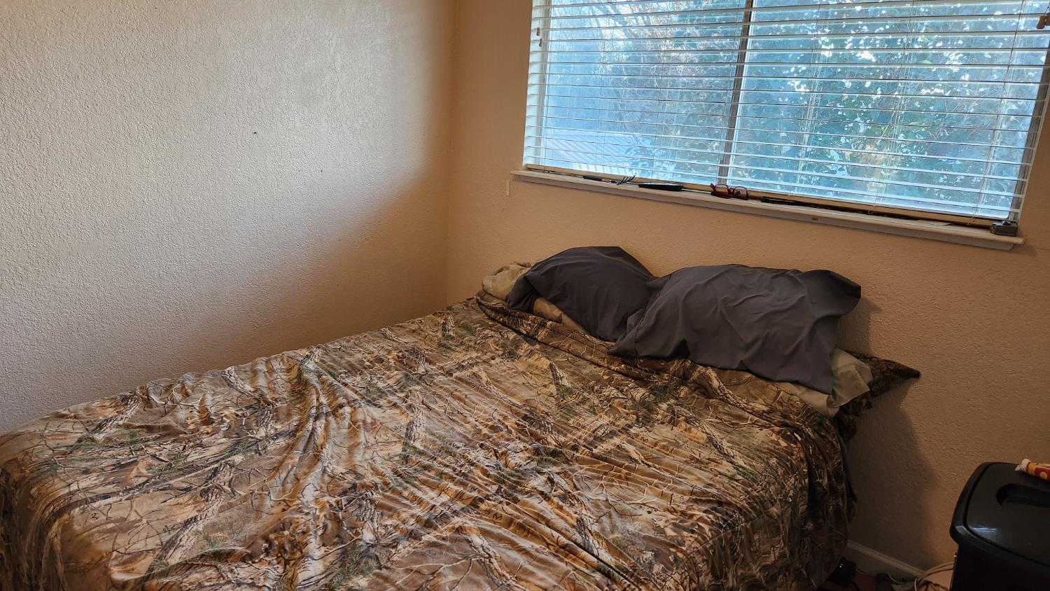 2786 Oak Street Anderson, CA 96007 - Photo 15 of 21 a bed sitting in a bedroom next to a window