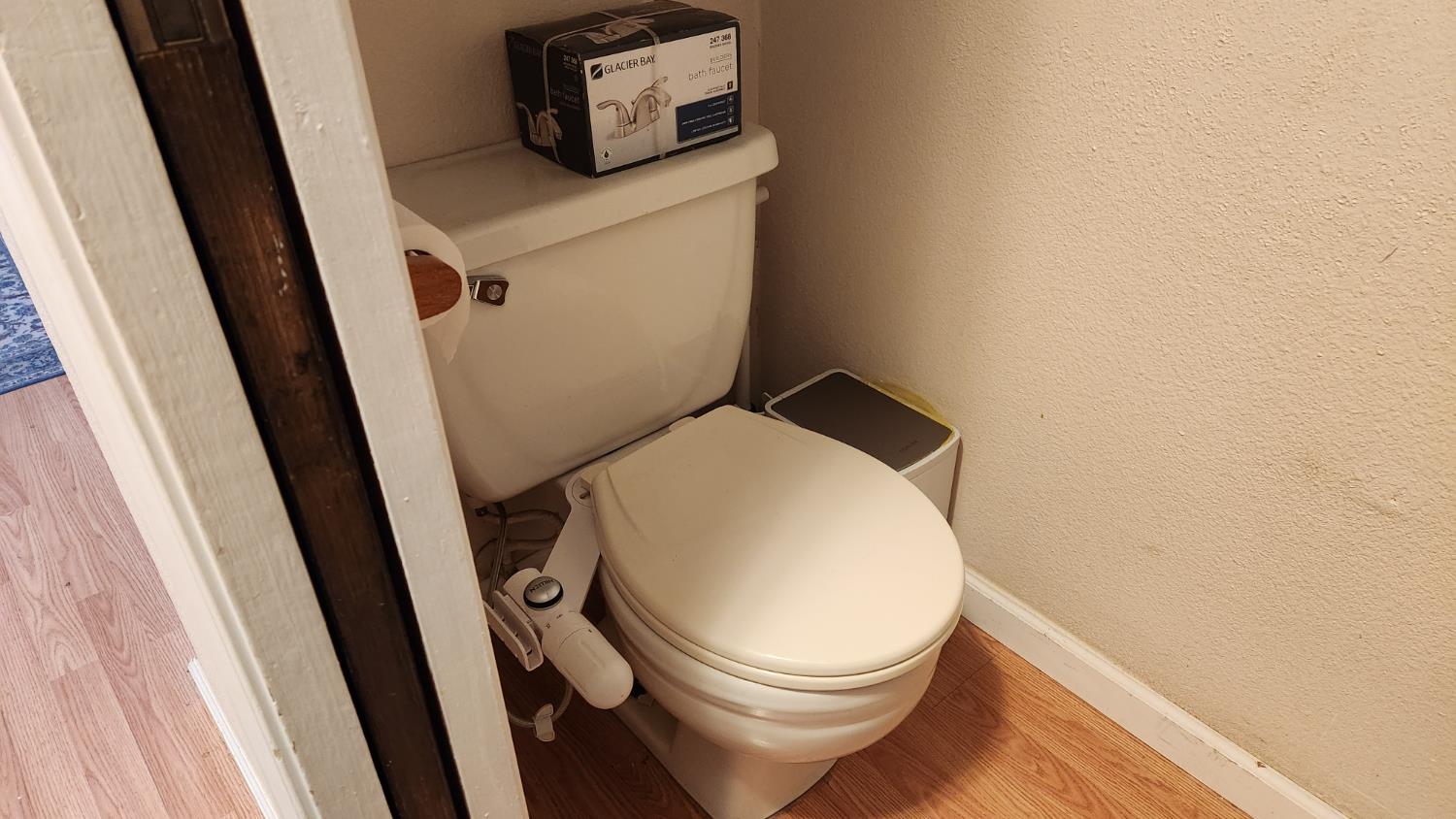 2786 Oak Street Anderson, CA 96007 - Photo 5 of 21 a white toilet sitting next to a sink and vanity