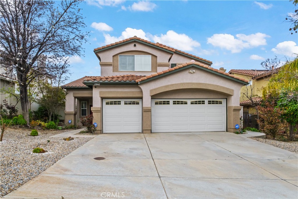 20842 Hillsdale Road Riverside, CA 92508 - Photo 1 of 1 a front view of a house with a yard and garage