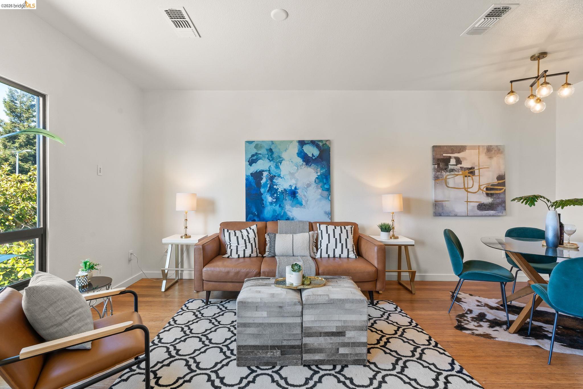 1780 12th Street Oakland, CA 94607 - Photo 12 of 31 a living room with furniture and wooden floor