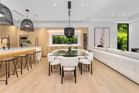 a living room with furniture a large window