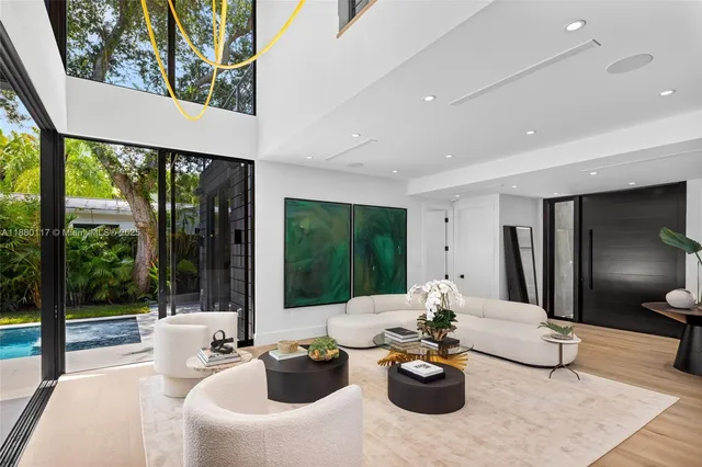 a bedroom with a large bed and a large window