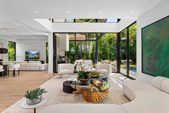 a view of an outdoor sitting area with furniture and a yard