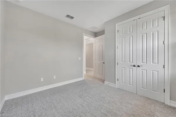 a view of a room with balcony and ocean view