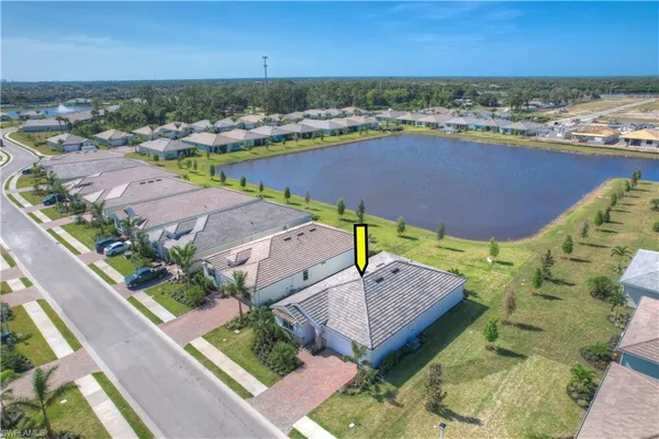 an aerial view of a house with a lake view