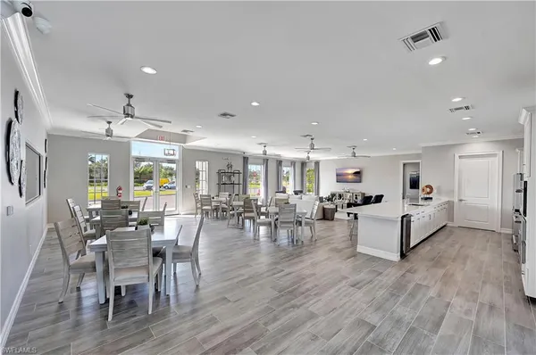 a large kitchen with a table and chairs