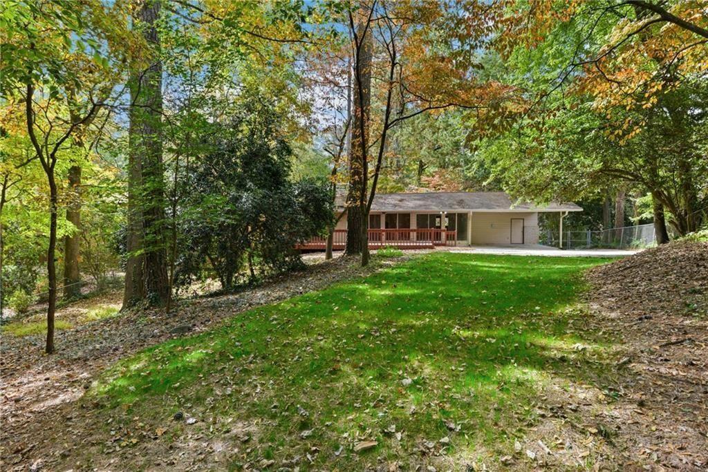 705 Edgewater Trail Sandy Springs, GA 30328 - Photo 10 of 36 a view of house with yard and sitting area
