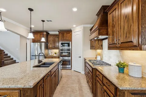 a kitchen with granite countertop lots of counter top space